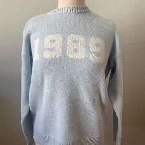 Stella Tweed Light Blue Crewneck Sweater with White '1989' Graphic